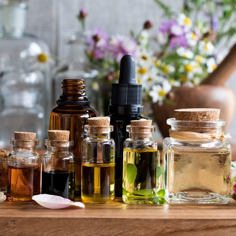 Assorted aromatherapy oil bottles on table – Polish essential oils for relaxation, sleep, and mood